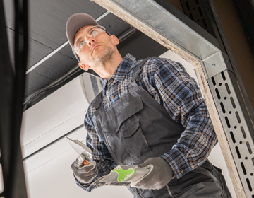 Crashed Garage Door Repair Services by Overhead Door Solutions in Texas